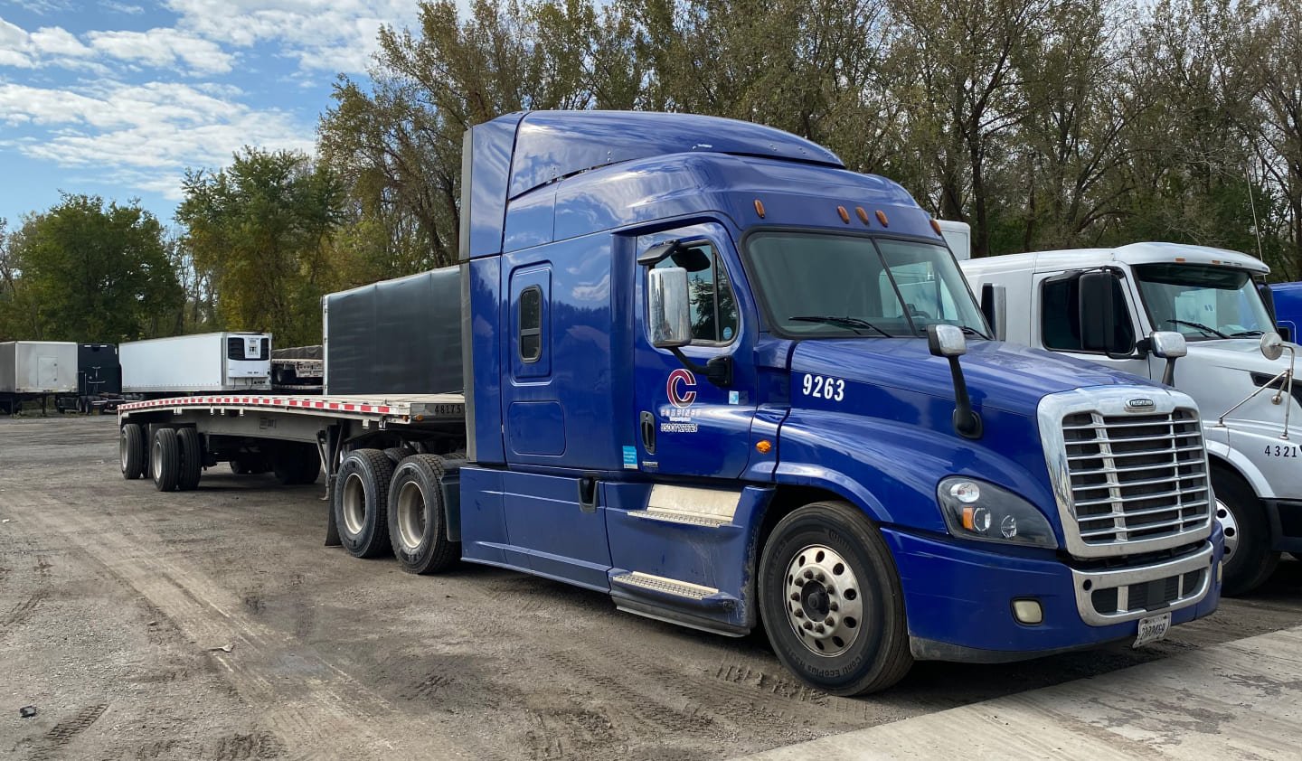 Modern flatbed truck in lot